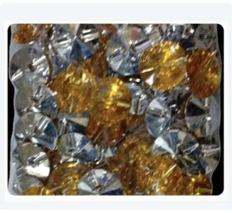 Silver and gold sofa buttons